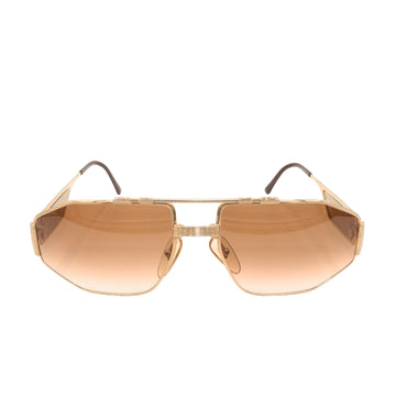Gold sunglasses by Christian Dior.